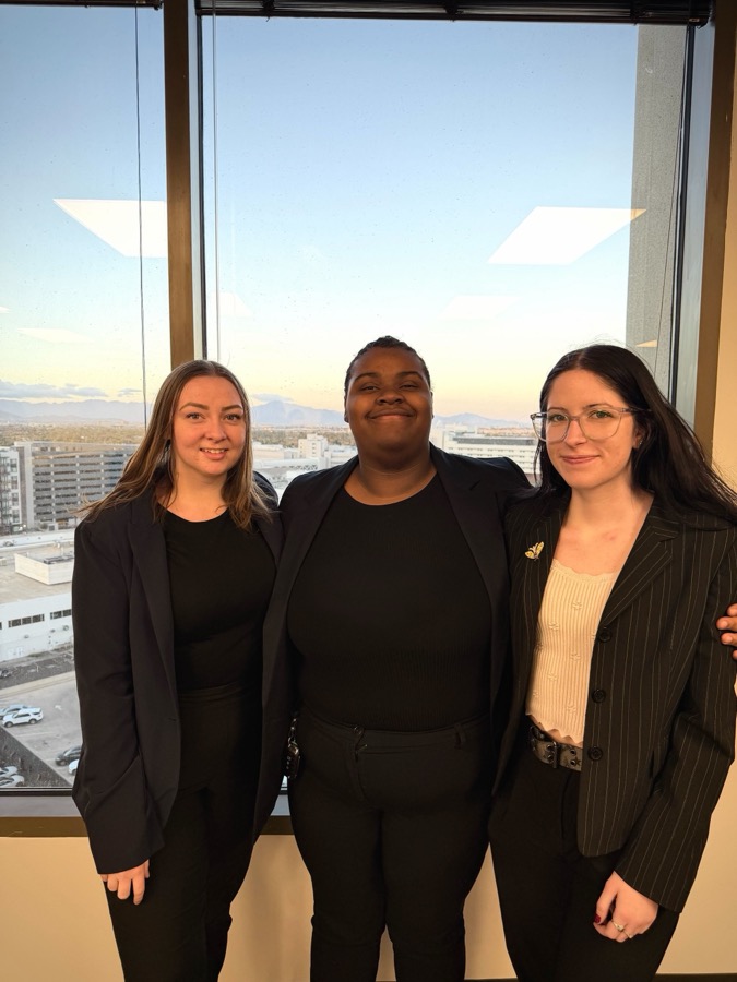 Reformed Marketing team at office with city view