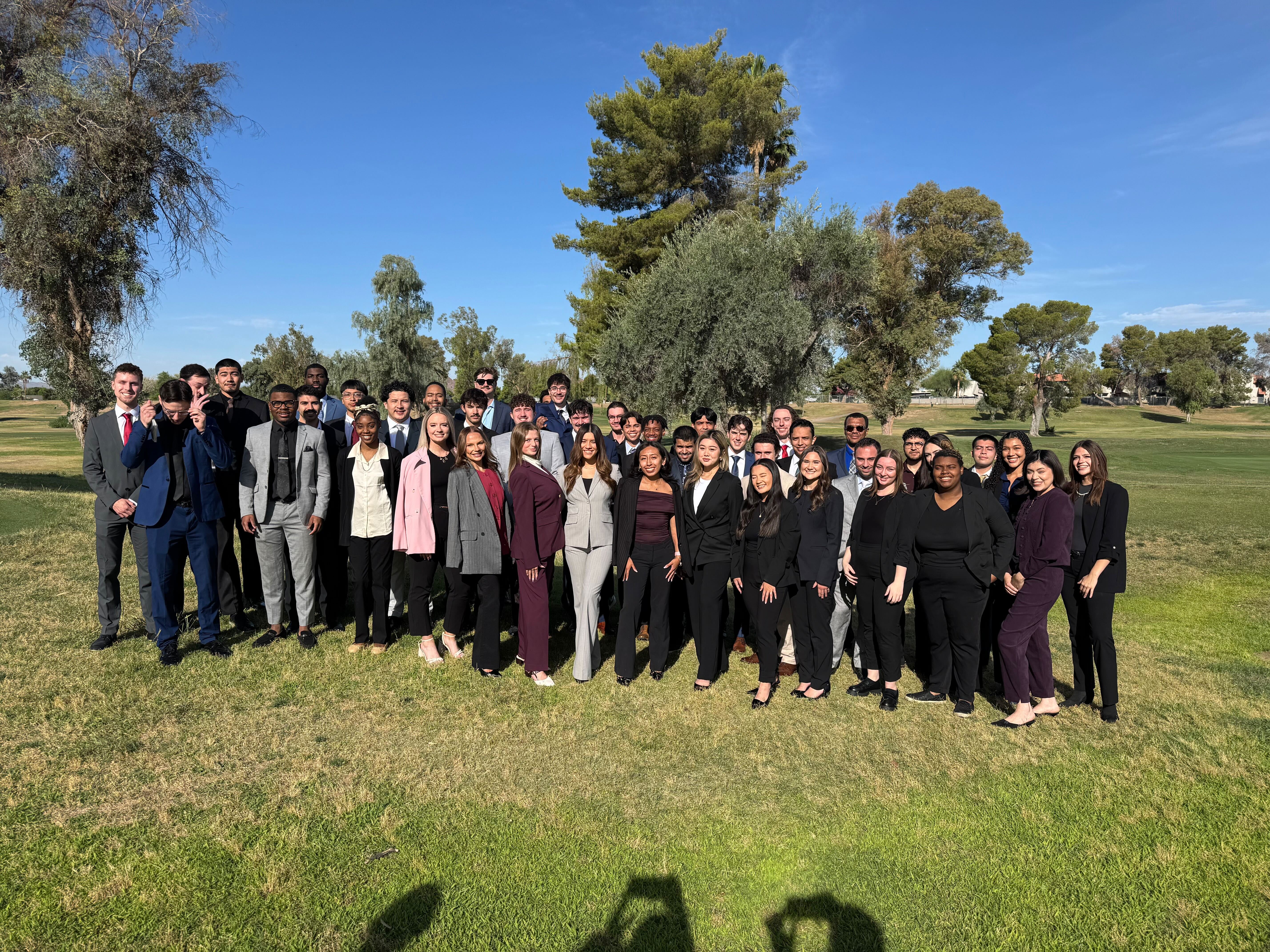 The Reformed Marketing team gathered outdoors — a large group in professional attire