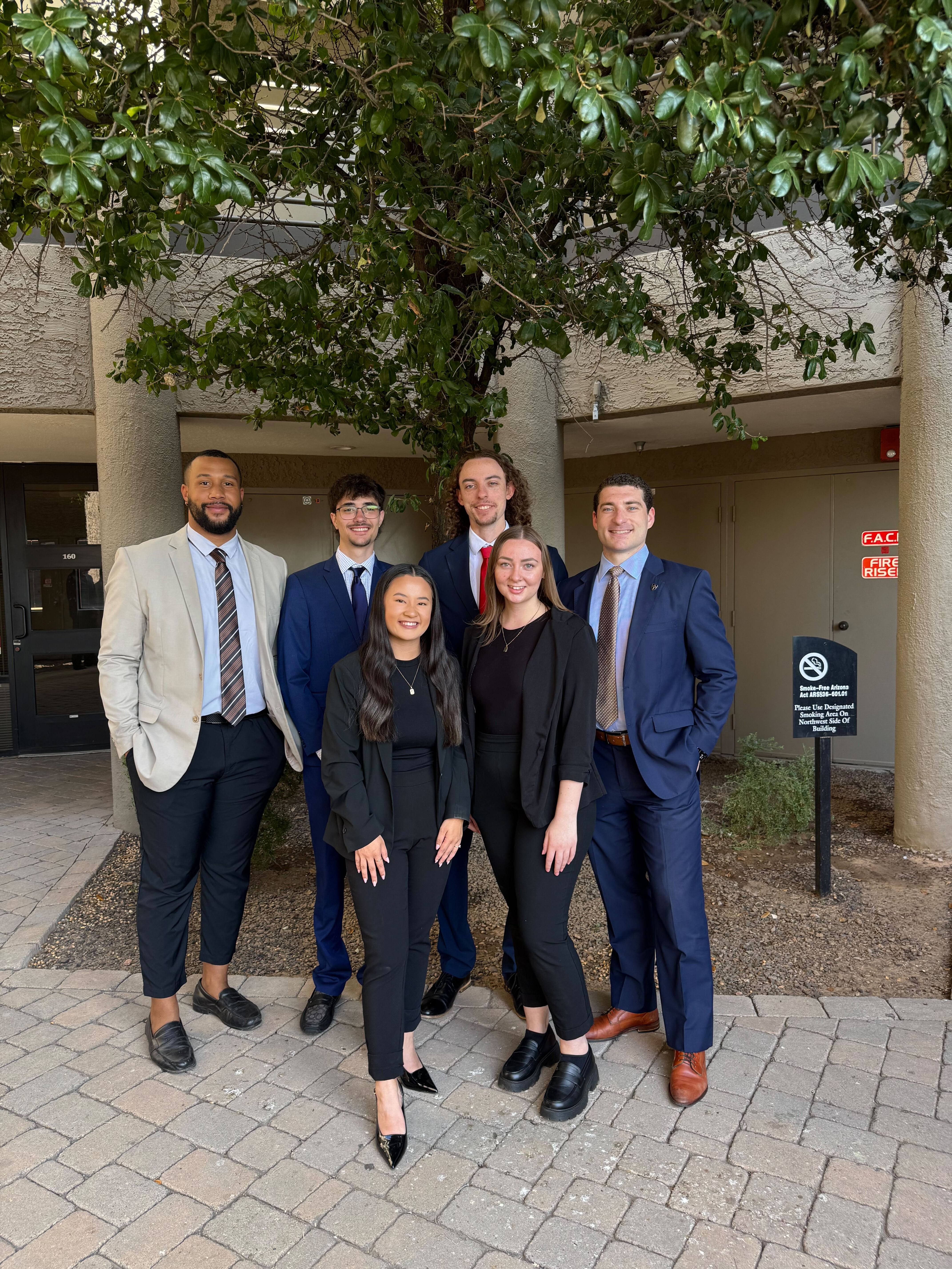 Small group of Reformed Marketing professionals in business attire