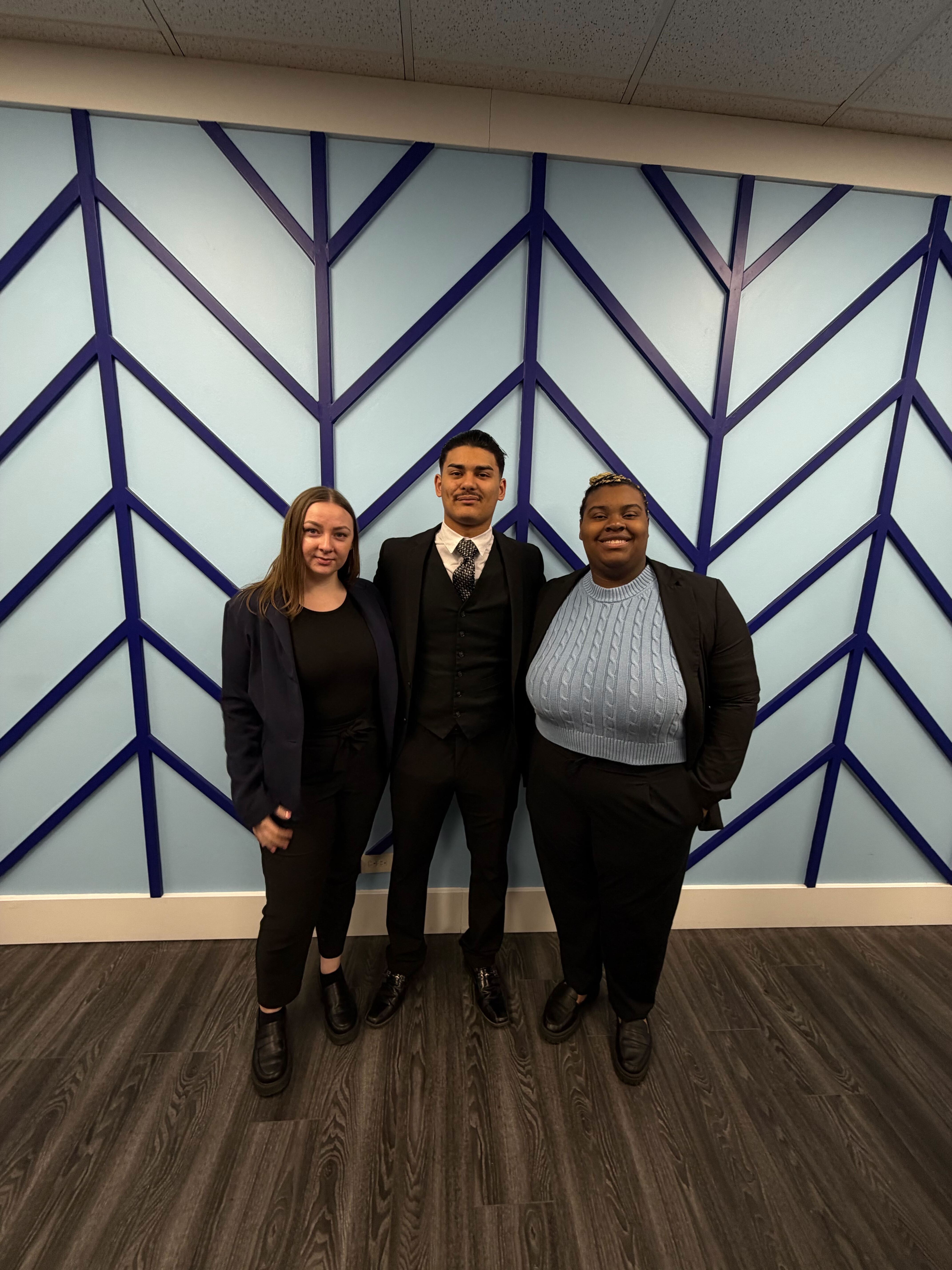 Three Reformed Marketing team members in the office