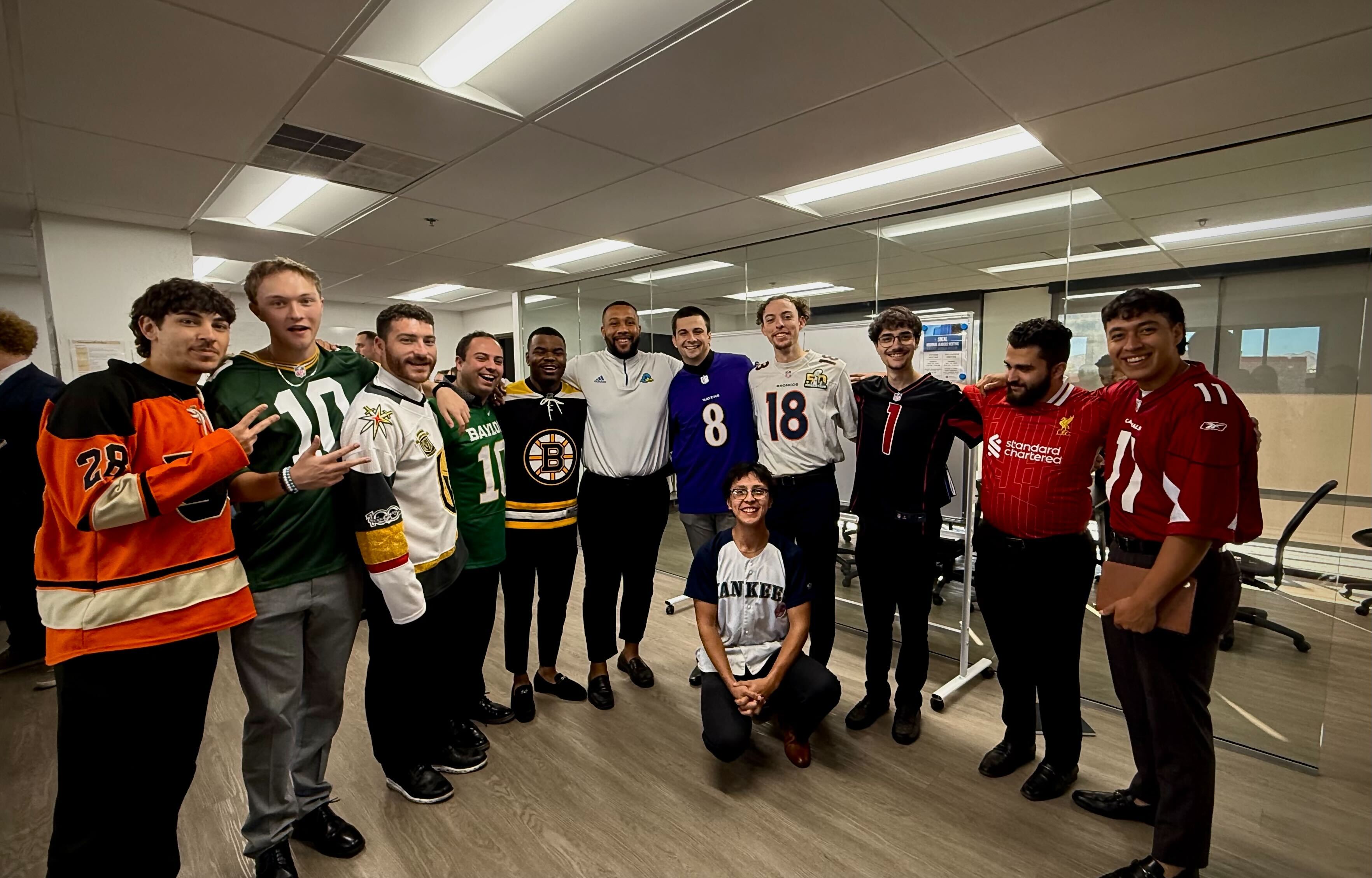 Reformed Marketing team celebrating culture day in sports jerseys